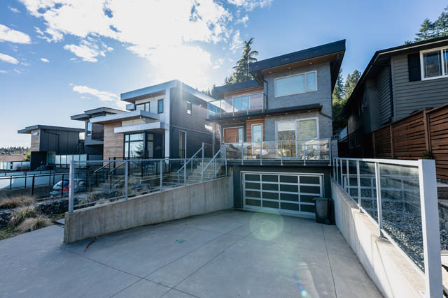 Bright 4-bedroom house with modern design, large windows, and a spacious patio. - Address WITHHELD, North Vancouver