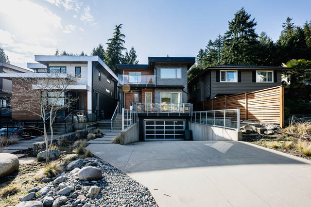 Bright living room with modern furnishings and large windows. - Address WITHHELD, North Vancouver