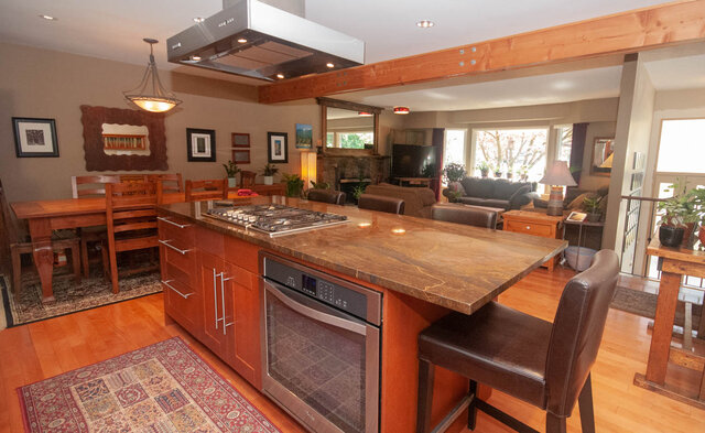 Spacious kitchen with granite countertops and hardwood floors, perfect for cooking and entertaining. - Upper - 2352 Riverbank Pl, North Vancouver