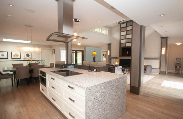 Spacious kitchen with granite countertops and hardwood floors. - Upper - 876 48th Ave, Vancouver West Side