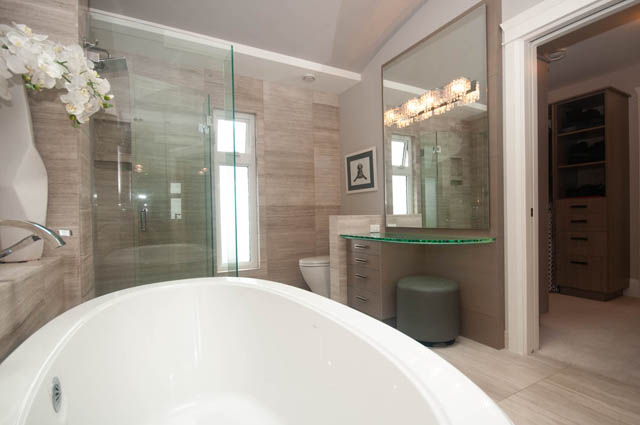 Spacious bathroom with modern fixtures, glass shower, and large mirror. - Upper - 876 48th Ave, Vancouver West Side