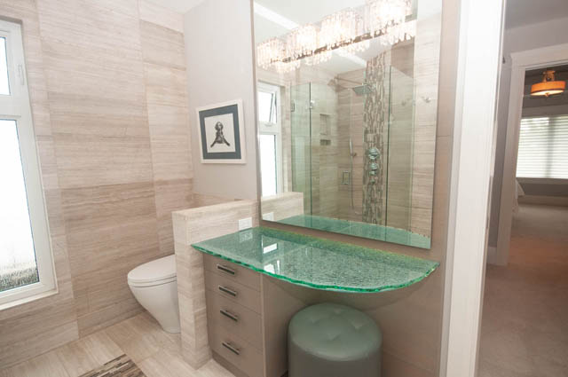 Modern bathroom with glass countertops and large mirror. - Upper - 876 48th Ave, Vancouver West Side
