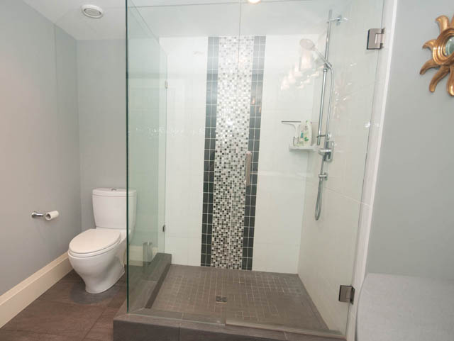 Bright bathroom with glass shower, mosaic tile accents, and modern fixtures. - Upper - 876 48th Ave, Vancouver West Side