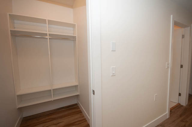 Bright walk-in closet with built-in shelves and hardwood floors. - 517 E 20th Ave, Vancouver East Side