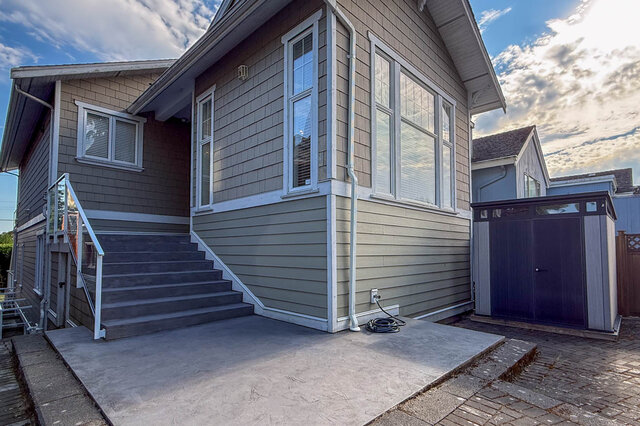 Spacious front patio with concrete steps and large windows. - 2307 Marine Drive, West Vancouver