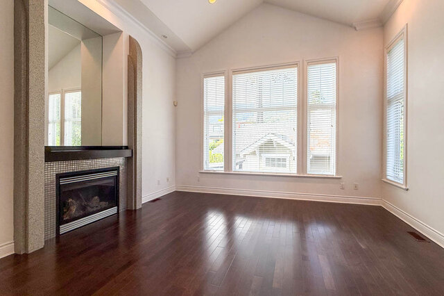 Spacious living room with hardwood floors and a fireplace. - 2307 Marine Drive, West Vancouver