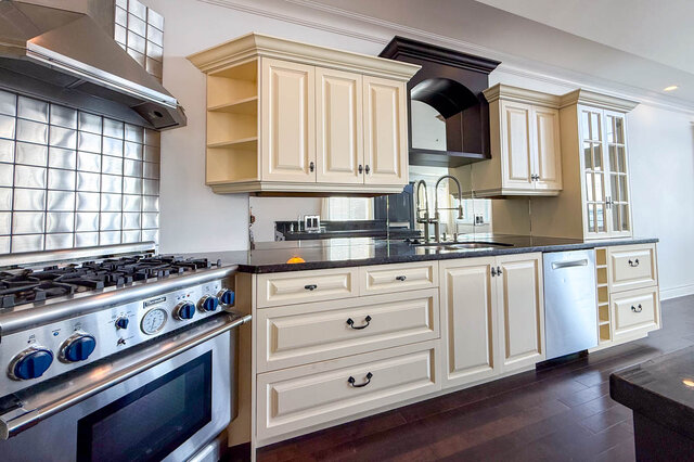Bright kitchen with dark granite countertops and rich hardwood floors. - 2307 Marine Drive, West Vancouver