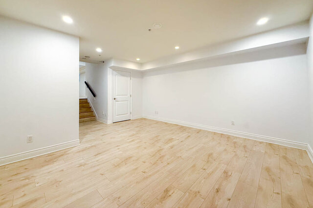 Bright living room with light hardwood floors and recessed lighting. - 2307 Marine Drive, West Vancouver