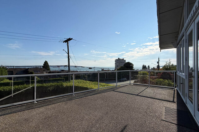 Balcony with ocean view and white railing overlooking West Vancouver. - 2307 Marine Drive, West Vancouver