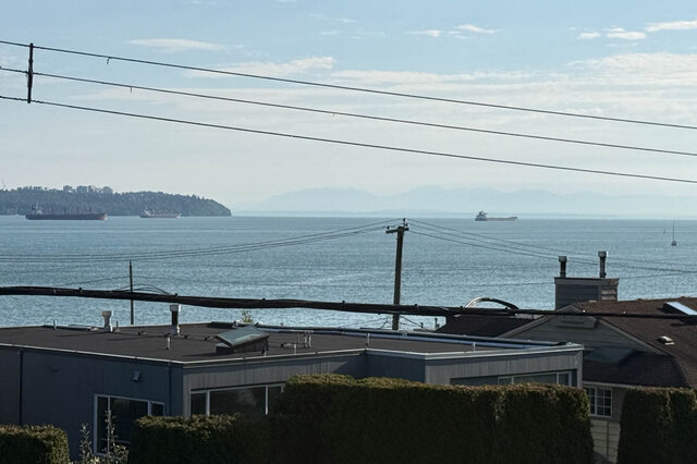 Spacious living room with ocean view and waterfront scenery. - 2307 Marine Drive, West Vancouver