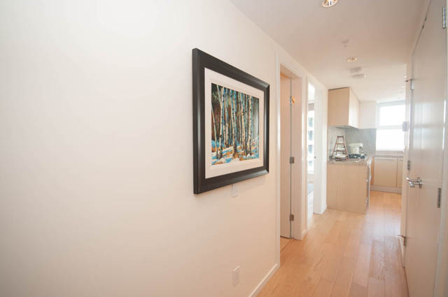 Bright kitchen with hardwood floors and modern appliances. - 3301 - 1351 Continental Street, Vancouver Downtown