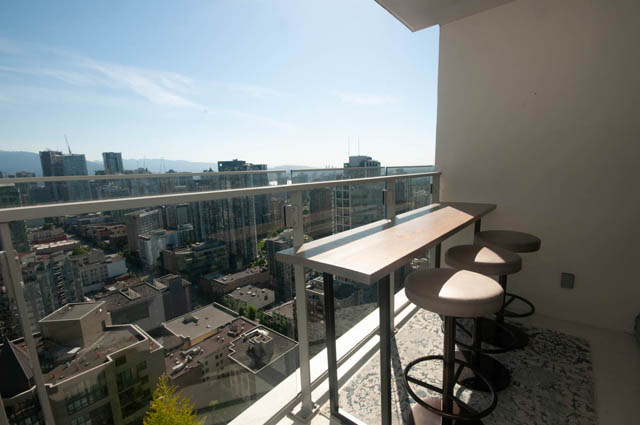 Bright balcony with city view and modern furniture. - 3301 - 1351 Continental Street, Vancouver Downtown