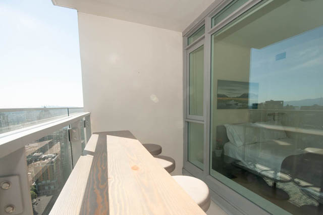 Furnished living room with city view and modern decor. - 3301 - 1351 Continental Street, Vancouver Downtown