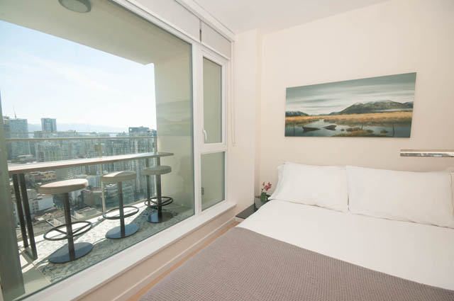 Bright living room with city view and modern decor. - 3301 - 1351 Continental Street, Vancouver Downtown