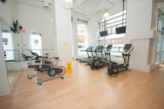 Bright fitness studio with hardwood floors and exercise equipment. - 3301 - 1351 Continental Street, Vancouver Downtown