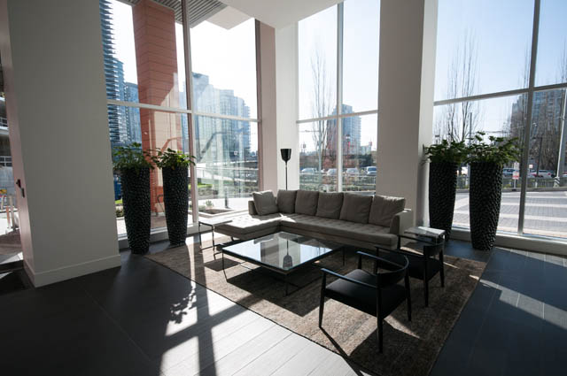 Bright living room with city view and modern furniture. - 3301 - 1351 Continental Street, Vancouver Downtown