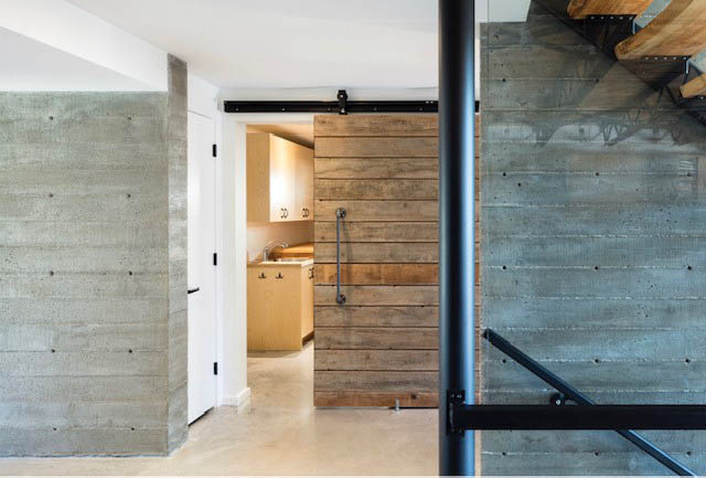 Bright kitchen with concrete walls and wooden accents, modern design. - Address WITHHELD, North Vancouver