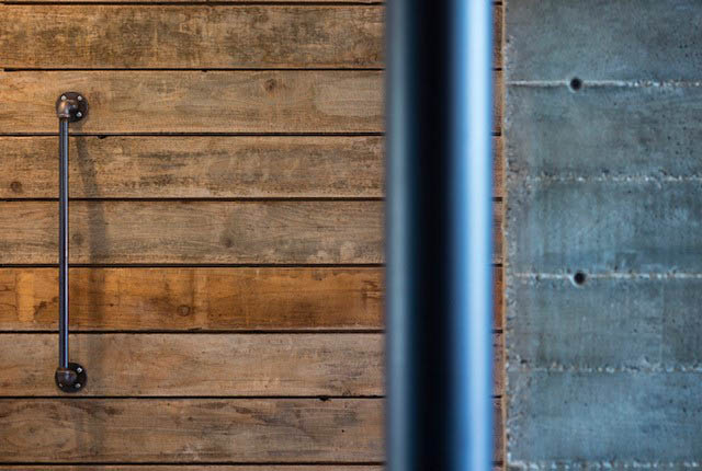 Bright kitchen with rustic wood paneling and industrial metal accents. - Address WITHHELD, North Vancouver