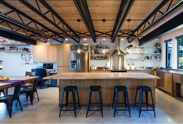 Bright kitchen with wooden countertops, black bar stools, and exposed beams. - Address WITHHELD, North Vancouver