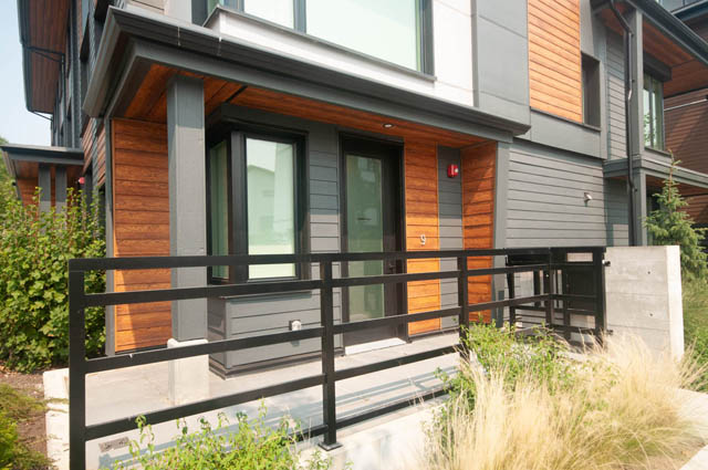 Spacious 4-bedroom townhouse with modern wooden exterior and sleek black railings. - 9 - 528 East 2nd, North Vancouver