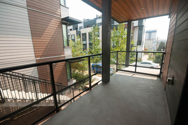 Spacious balcony with modern railings and city views. - 9 - 528 East 2nd, North Vancouver