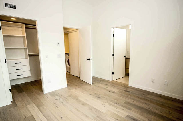 Bright bedroom with hardwood floors and built-in closet. - 9 - 528 East 2nd, North Vancouver