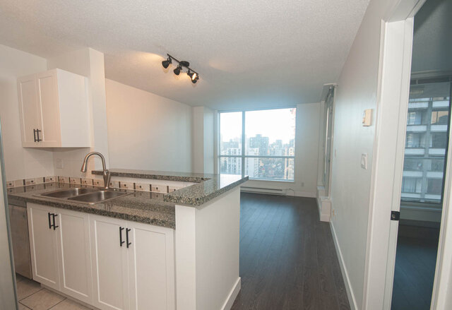 Bright kitchen with granite countertops, hardwood floors, and a city view. - 1907 - 1420 West Georgia Street, Vancouver Downtown