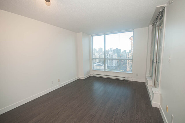 Spacious living room with hardwood floors and a stunning city view. - 1907 - 1420 West Georgia Street, Vancouver Downtown
