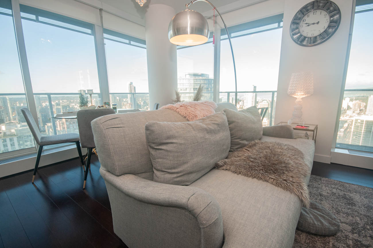 Furnished living room with city view and modern decor. - 4502 - 777 Richards St, Vancouver Downtown