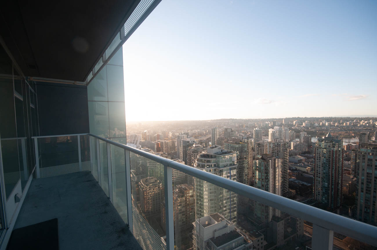 Bright balcony with stunning city view and modern glass railing. - 4502 - 777 Richards St, Vancouver Downtown