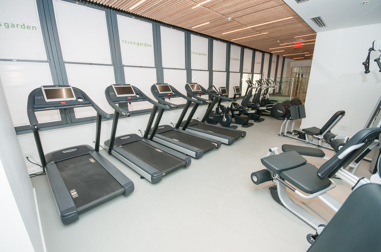 Bright gym with treadmills and weight machines, clean and modern. - 4502 - 777 Richards St, Vancouver Downtown