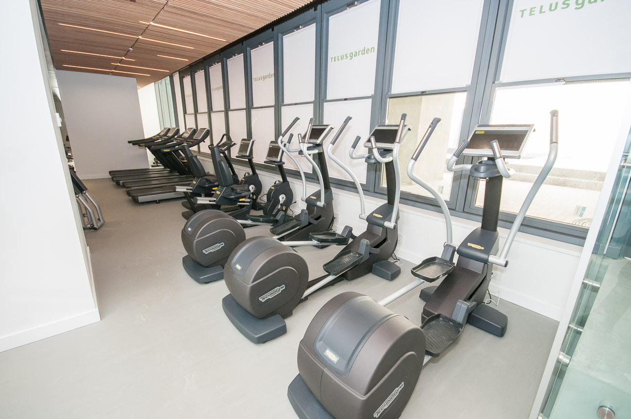 Bright gym with treadmills and ellipticals, large windows. - 4502 - 777 Richards St, Vancouver Downtown