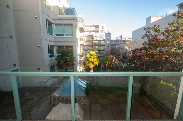 Spacious balcony with city views, palm trees, and modern furnishings. - 308 - 1688 Cypress Street, Vancouver West Side