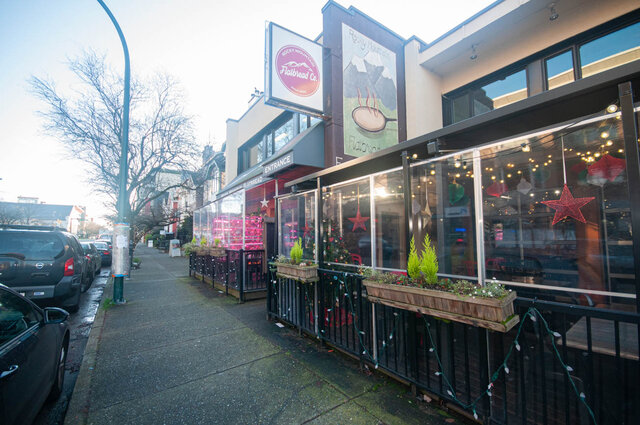 Furnished patio with festive lights and greenery at Rocky Mountain Flatbread Co. - 308 - 1688 Cypress Street, Vancouver West Side