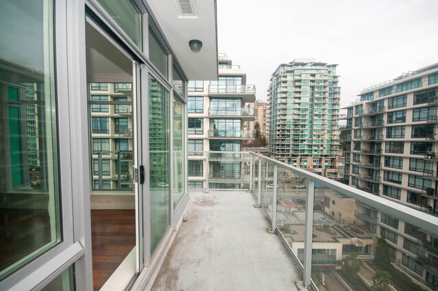 Spacious balcony with stunning city views and modern furnishings. - 912 - 175 Victory Ship Way, North Vancouver