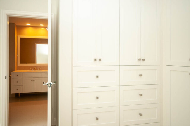 Furnished bathroom with white cabinetry and modern sink. - 912 - 175 Victory Ship Way, North Vancouver