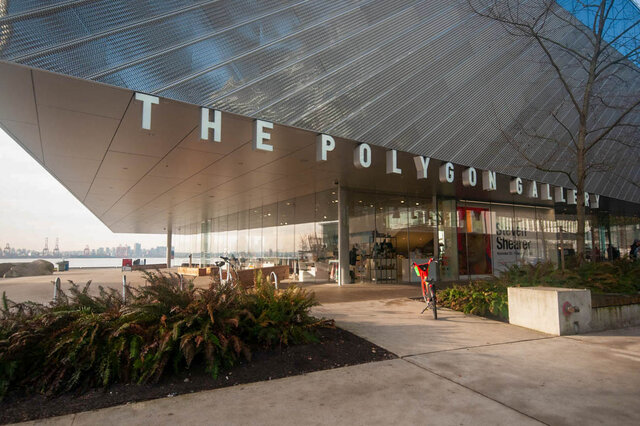 Spacious living room with a stunning city view and modern furnishings. - 912 - 175 Victory Ship Way, North Vancouver