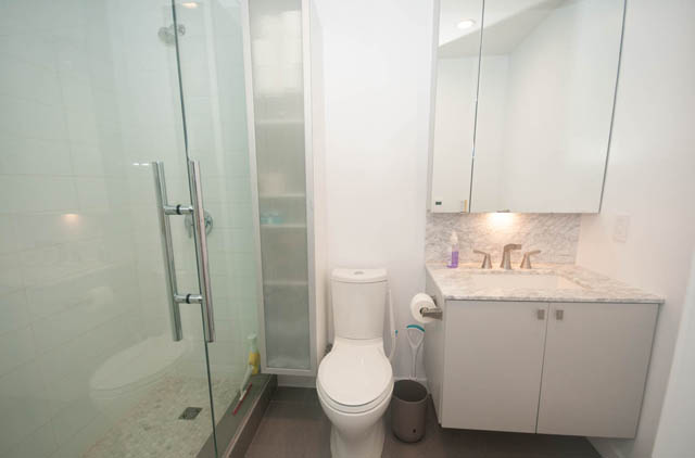 Spacious bathroom with marble countertops and modern fixtures. - 305 -1819 West 5th Ave, Vancouver West Side
