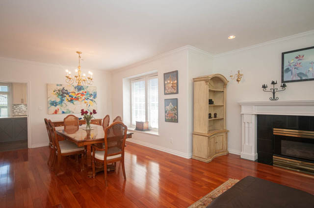 Furnished dining area with hardwood floors, chandelier, and artwork. - Upper  - 2318 West 14th Ave, Vancouver West Side