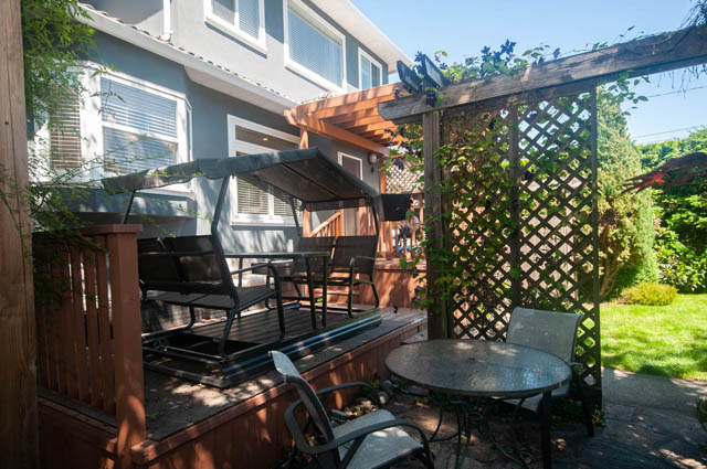 Furnished patio with wooden pergola, outdoor furniture, and greenery. - Upper  - 2318 West 14th Ave, Vancouver West Side