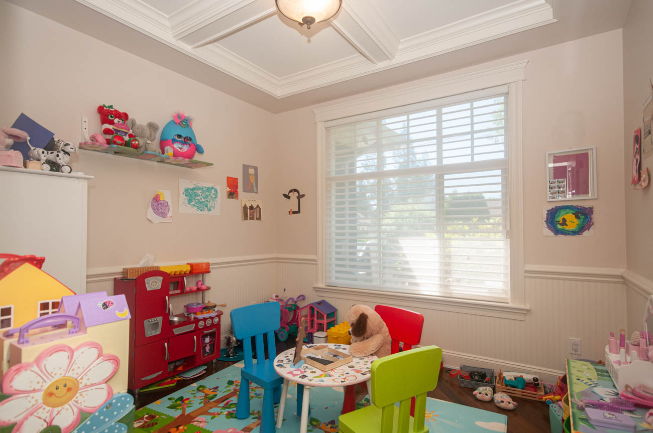 Bright playroom with colorful toys, art, and a cozy corner. - 3440 Wellington Crescent, North Vancouver