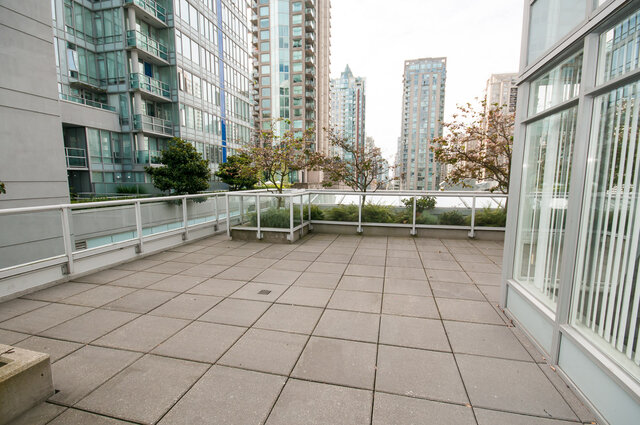 A balcony with tiled flooring, railing, small trees. - 1306-480 Robson Street, Vancouver Downtown