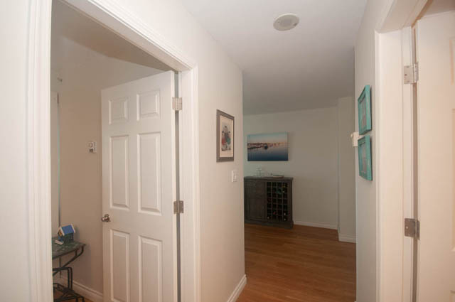Spacious hallway leading to a cozy living area with hardwood floors and a modern decor. - 801-1128 Quebec st, Vancouver Downtown