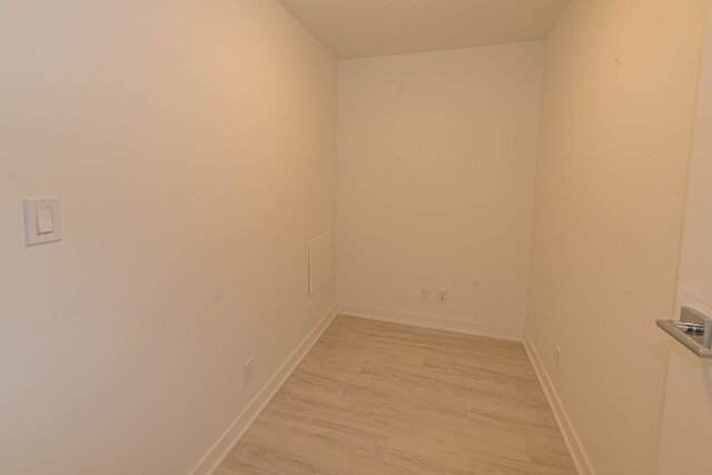 Den with light wood flooring and built-in bench seating. - 1105 - 1401 Hunter Street, North Vancouver