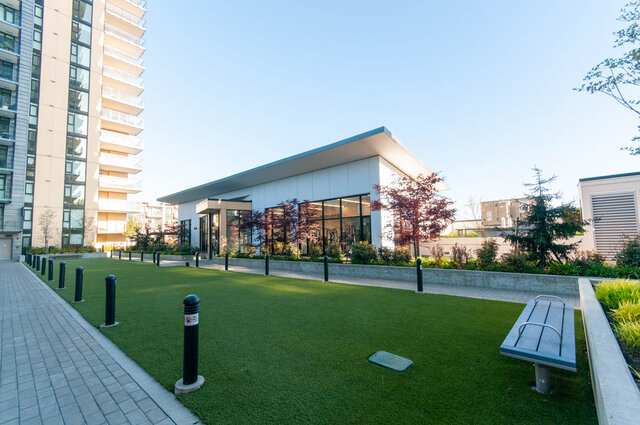 Spacious living room with modern furnishings and a large balcony overlooking the city. - 1105 - 1401 Hunter Street, North Vancouver