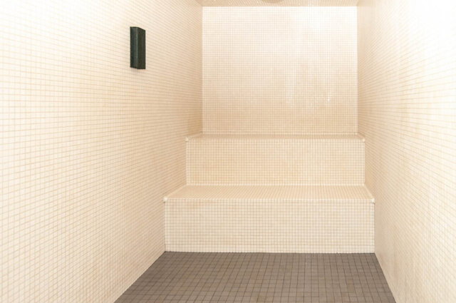 Spacious, well-lit sauna with tiled walls and steps. - 1105 - 1401 Hunter Street, North Vancouver