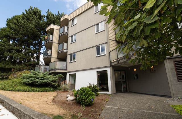 Bright 1-bedroom condo with modern balcony and lush greenery surrounding. - 306 - 212 Forbes Ave, North Vancouver