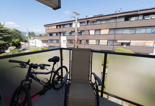 Balcony with bike and city view. - 306 - 212 Forbes Ave, North Vancouver