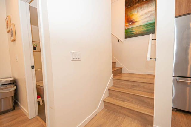 Bright kitchen with stainless steel appliances and hardwood floors. - 30 - 533 East 3rd st., North Vancouver