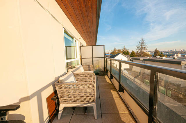 Furnished balcony with outdoor seating and city view. - 30 - 533 East 3rd st., North Vancouver